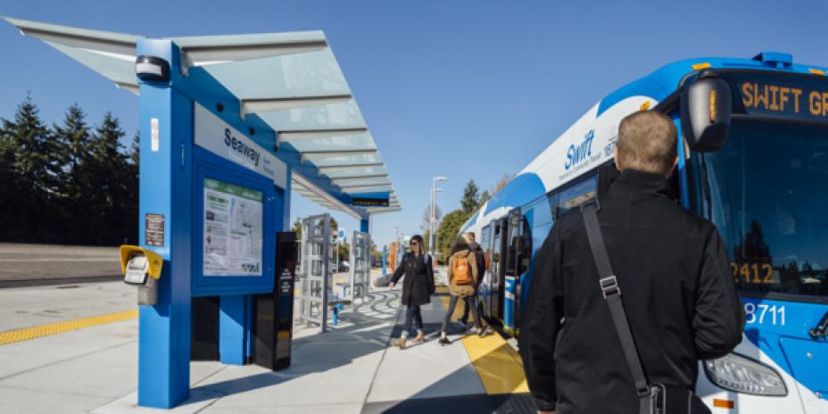 Passengers boarding public transit bus
