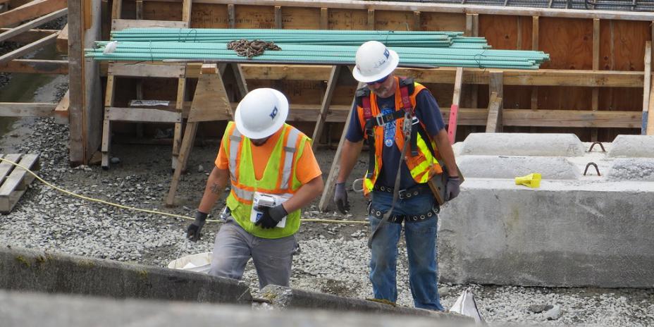 Two construction workers in construction site