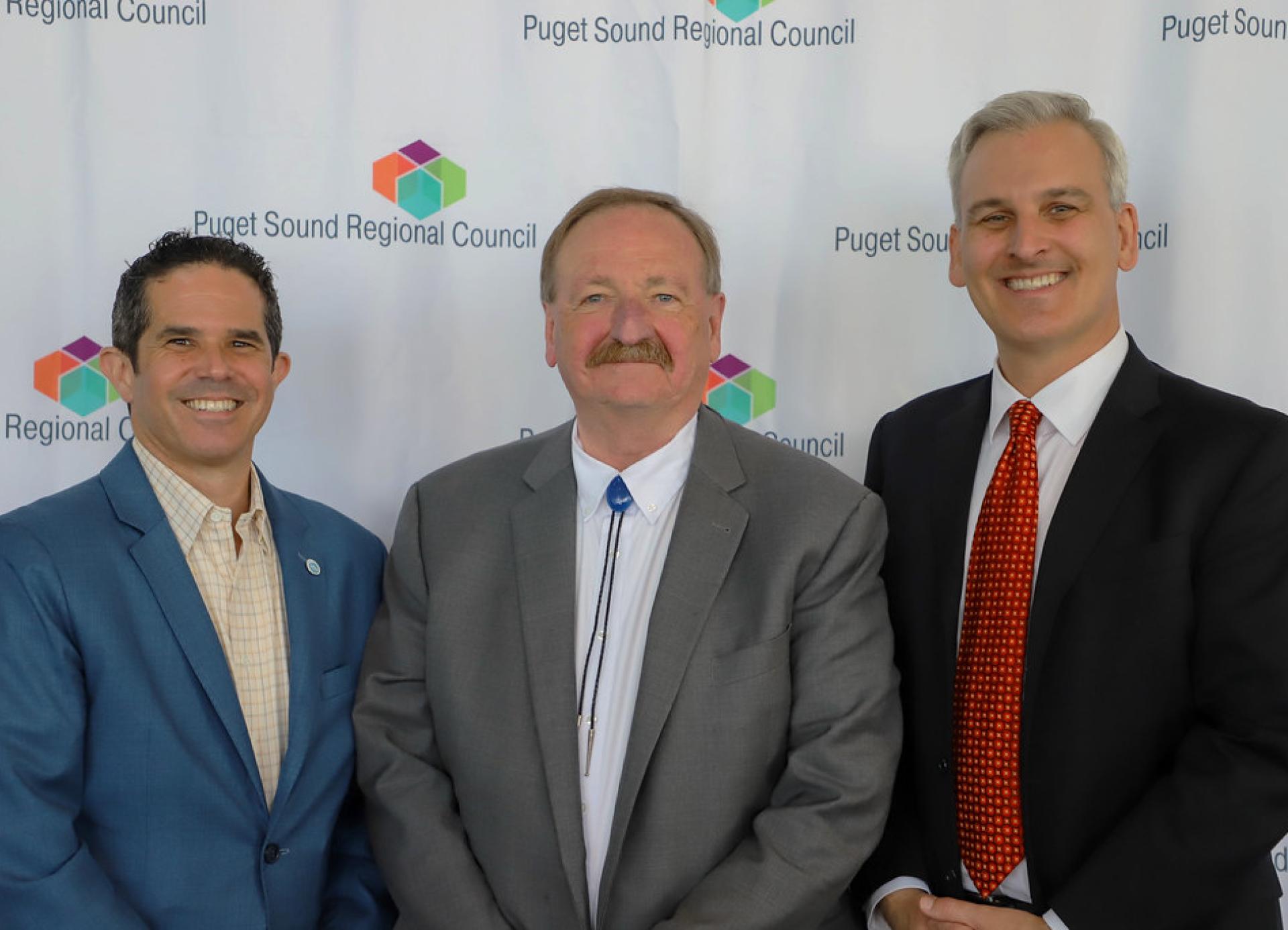 Left to right: Pierce County Executive Ryan Mello, PSRC Vice President; Snohomish County Executive Dave Somers, PSRC President; Executive Director Josh Brown